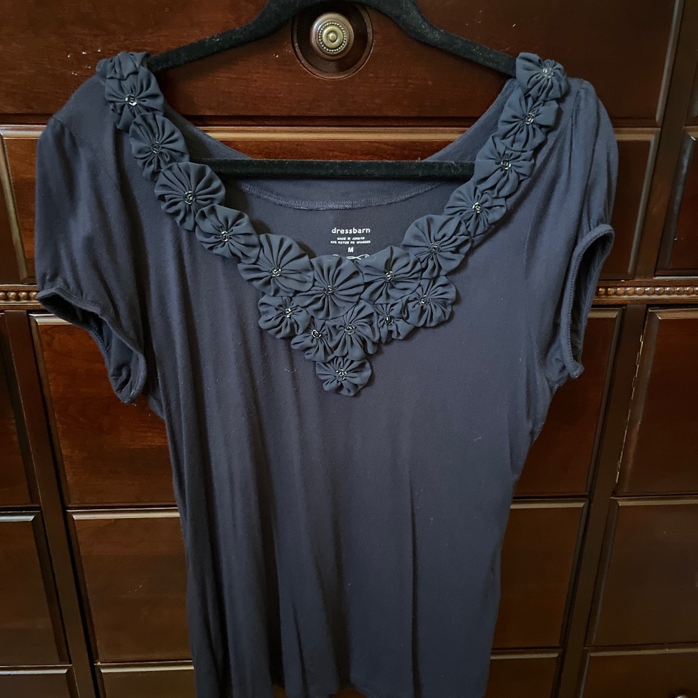 Navy blue top with rosettes